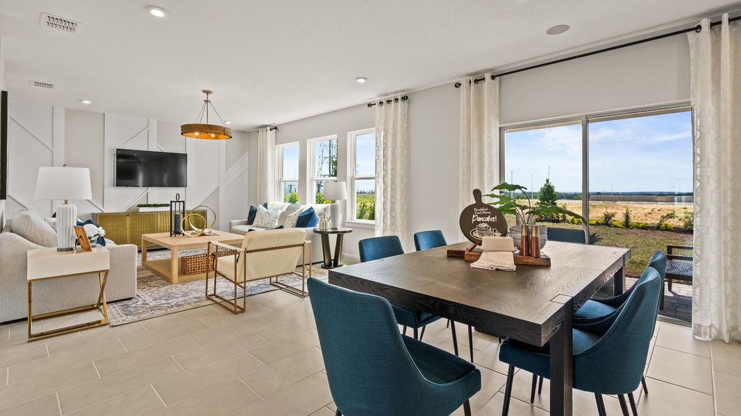 The Dining and Living Area in the Open Concept Model Highbourne by DRB Homes in Hamilton Bluff located in Haines City, FL. The Dining and Living Area in the Open Concept Model Highbourne by DRB Homes in Hamilton Bluff located in Haines City, FL.
