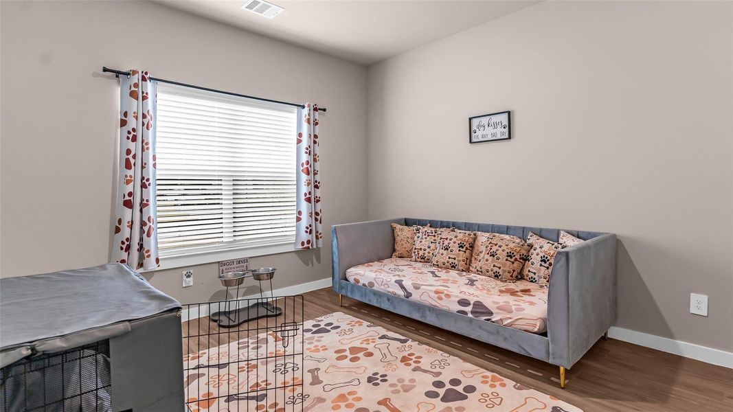 This 1st floor bedroom located at the front of the home with walk in closet and a full bath.