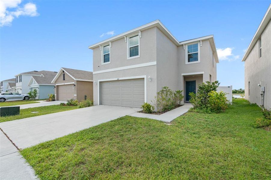 Front exterior of a new home in , Ruskin, FL, highlighting curb appeal (Image 2). Front exterior of a new home in , Ruskin, FL, highlighting curb appeal (Image 2).