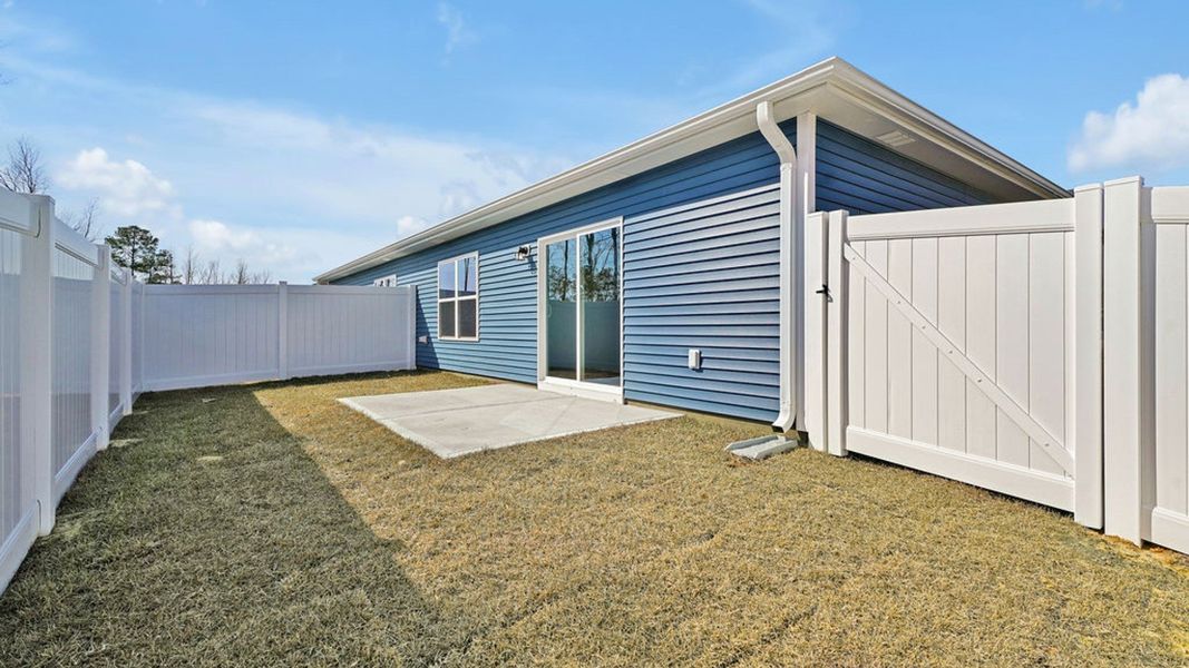 Exterior details and patio area of a home in Indigo Preserve Townhomes, Leland (Image 2). Exterior details and patio area of a home in Indigo Preserve Townhomes, Leland (Image 2).