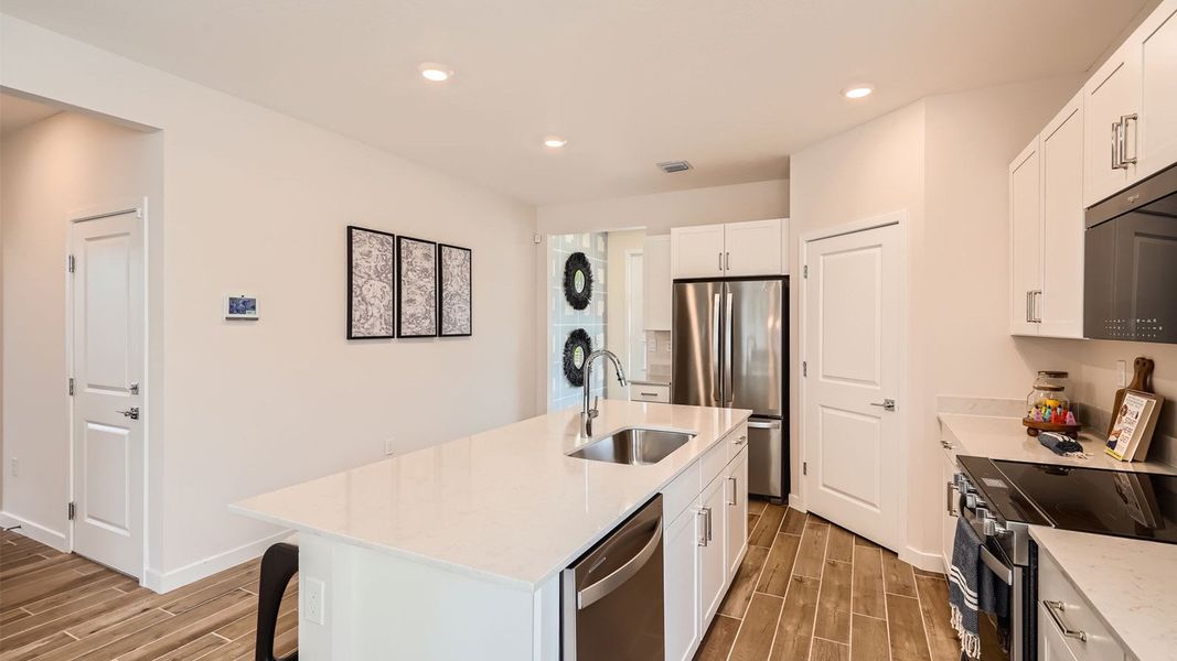 Representative furnished interior of a home built from the Grandcourt by D.R. Horton in Parker Pointe, Homestead (Image 9).