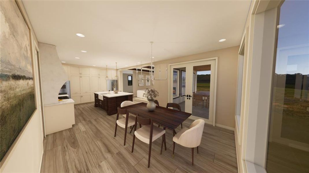 Dining area with french doors, light wood-type flooring, and recessed lighting
