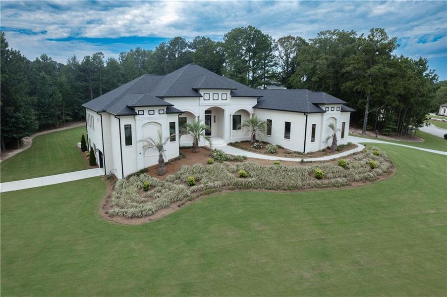 Front exterior of a new home in , Stockbridge, GA, highlighting curb appeal (Image 1).