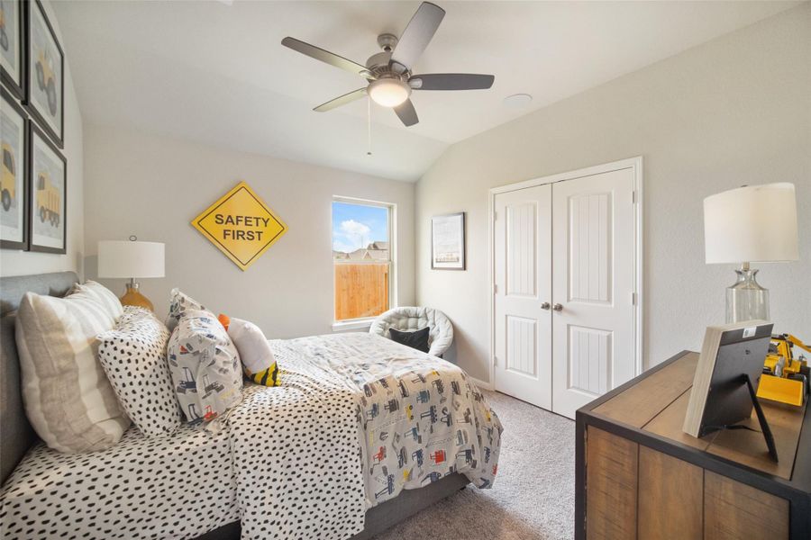 Generously sized secondary bedrooms featuring spacious closets, soft and inviting carpeting underfoot, large windows allowing plenty of natural light, and the added touch of privacy blinds for your personal retreat. Sample photo of completed home with similar floor plan. Actual colors and selections may vary.