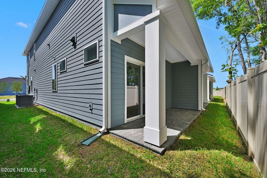 Exterior details and patio area of a home in Baxley Villas, Middleburg (Image 2). Exterior details and patio area of a home in Baxley Villas, Middleburg (Image 2).