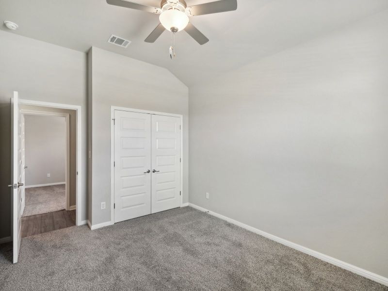 Two of the secondary bedrooms share a bathroom with dual sinks.