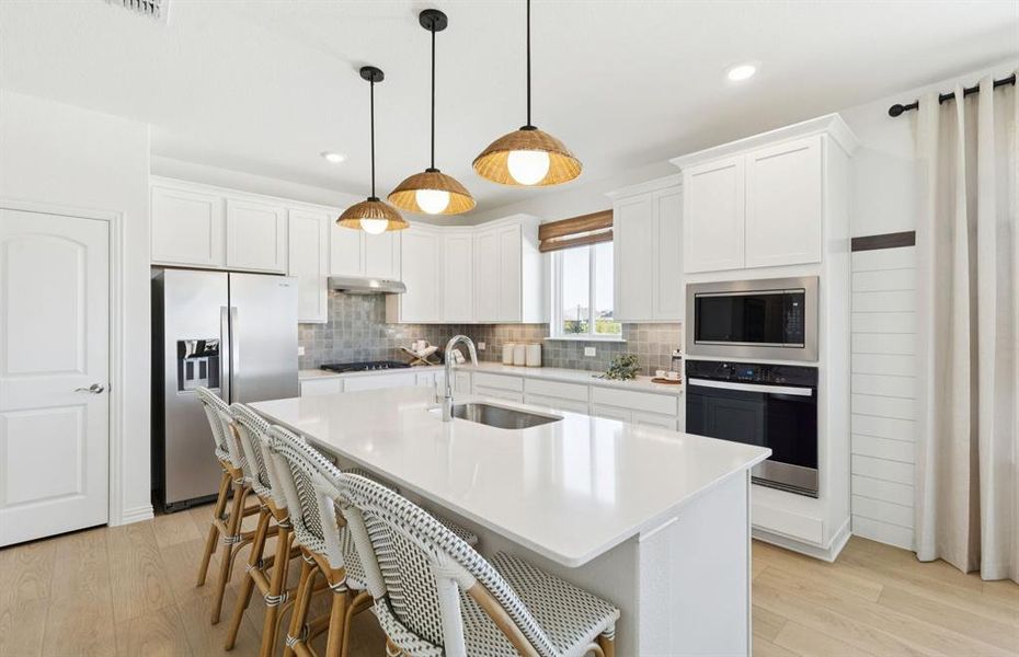 *Model Representation - Spacious kitchen with eat-in bartop island