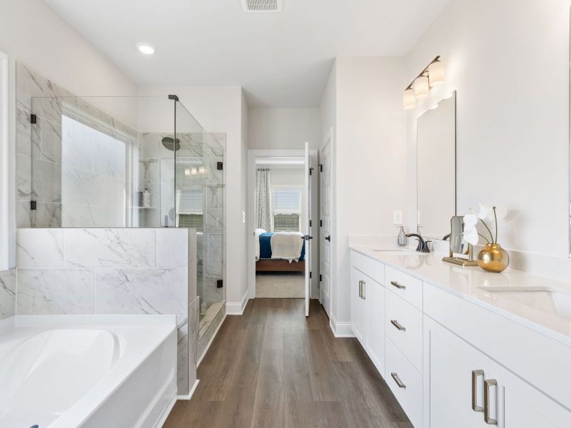 Getting ready in the morning is a breeze with the spacious dual-vanity countertop.