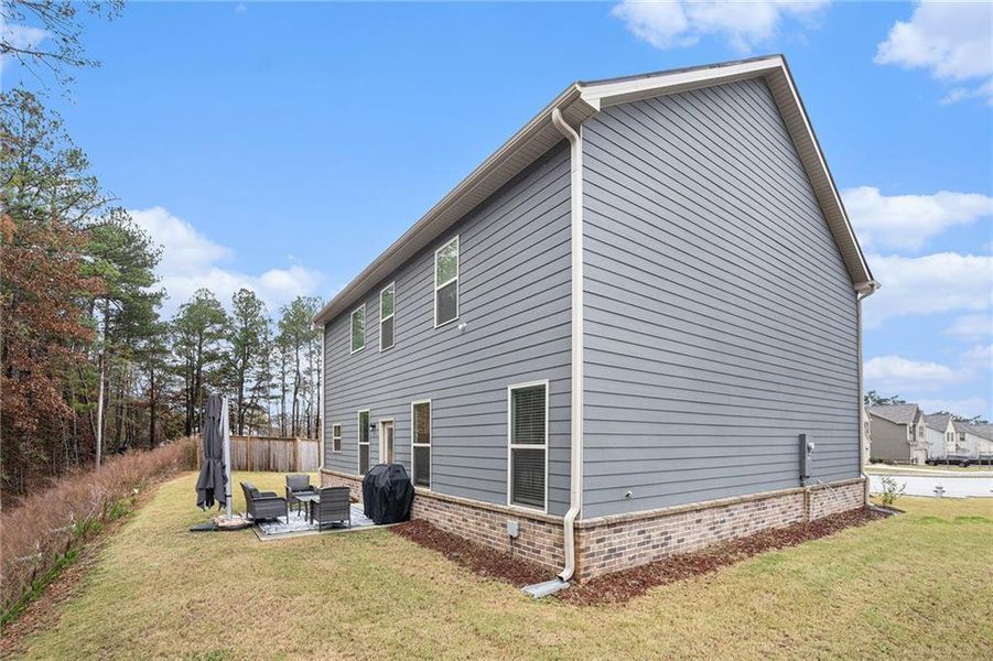Exterior details and patio area of a home in Ridgewater, Loganville (Image 22).