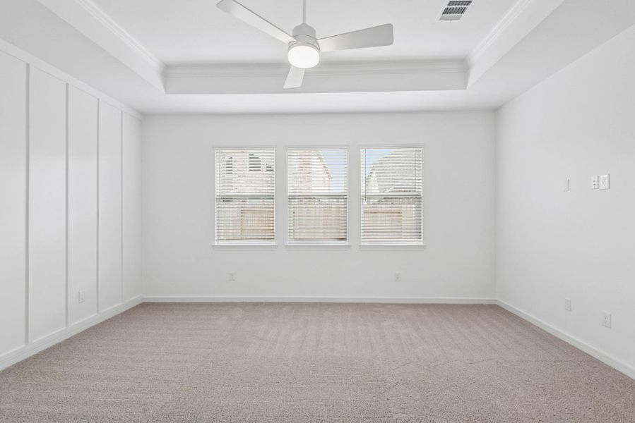 Spacious primary suite with feature wall (*Photo not of actual home and used for illustration purposes only.)