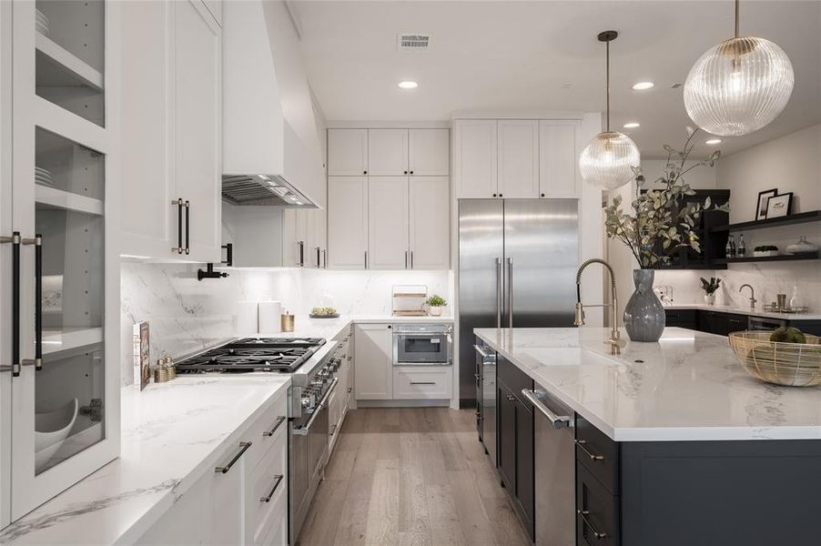 Step into culinary luxury in this new construction home, boasting a kitchen equipped with dual dishwashers, dual ovens, a six-burner Thermador range, a pot filler, and a commercial-grade ventilation system.