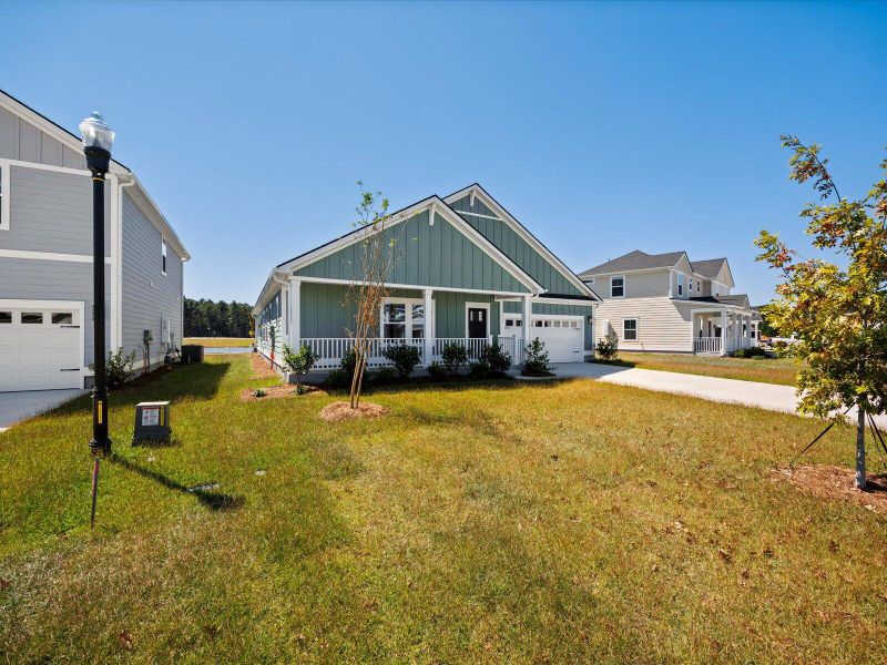 Exterior details and patio area of a home in The Coves at Lakes of Cane Bay II, Summerville (Image 3).