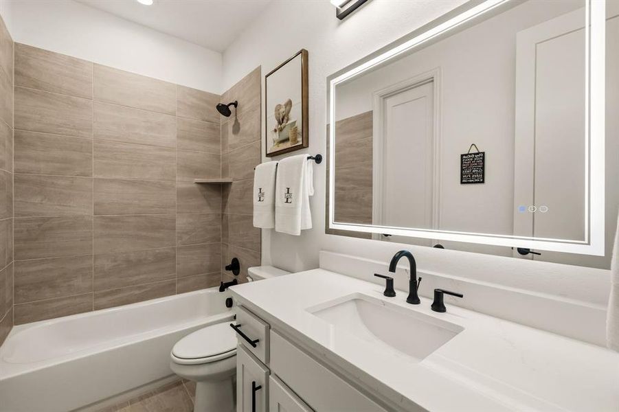 Furnished interior view inside a new home in , The Colony (Image 33).