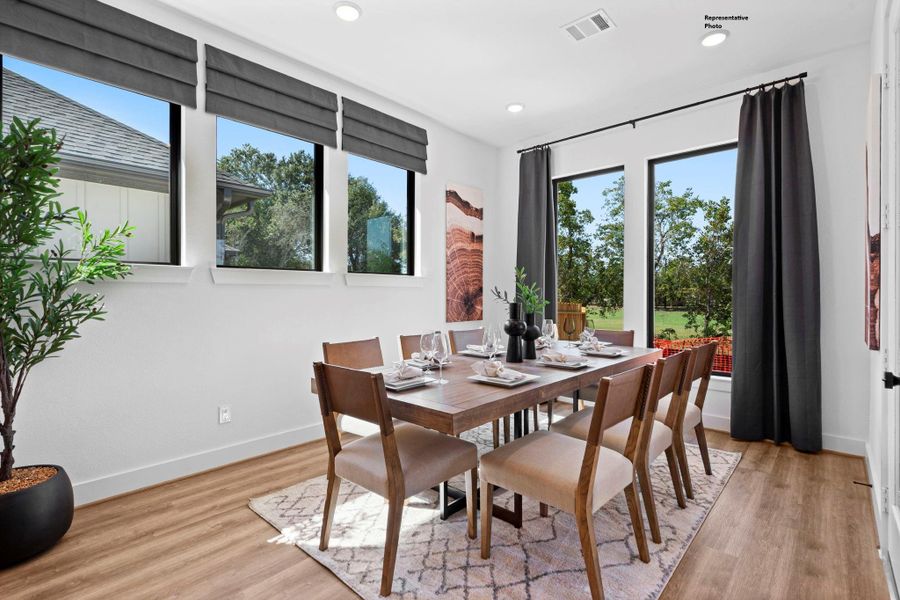 The dining room serves as a central gathering space, designed for comfort and connection. Ample room for seating and thoughtful design details make it perfect for everyday meals and special occasions alike.