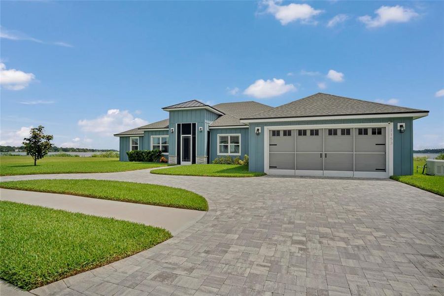 Front exterior of a new home in , Auburndale, FL, highlighting curb appeal (Image 25).