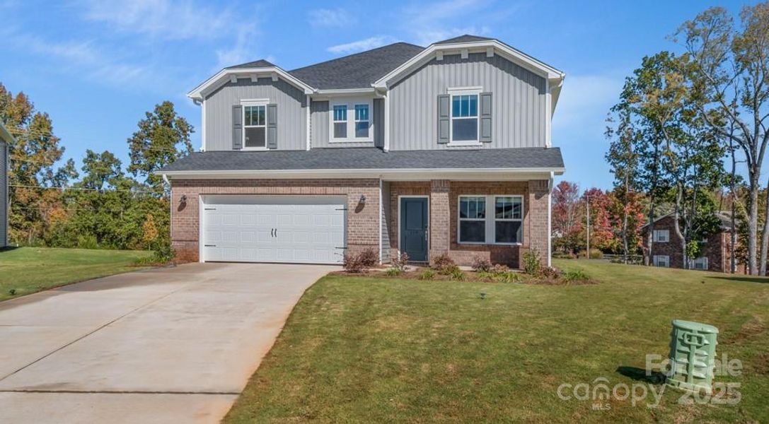 Front exterior of a new home in Nelson's Creek, Mocksville, NC, highlighting curb appeal (Image 1). Front exterior of a new home in Nelson's Creek, Mocksville, NC, highlighting curb appeal (Image 1).
