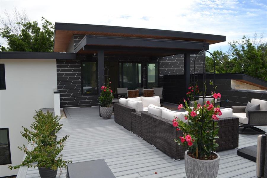 Wooden deck with an outdoor living space Wooden deck with an outdoor living space
