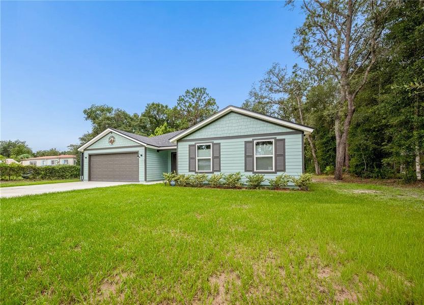 Front exterior of a new home in , Satsuma, FL, highlighting curb appeal (Image 24). Front exterior of a new home in , Satsuma, FL, highlighting curb appeal (Image 24).