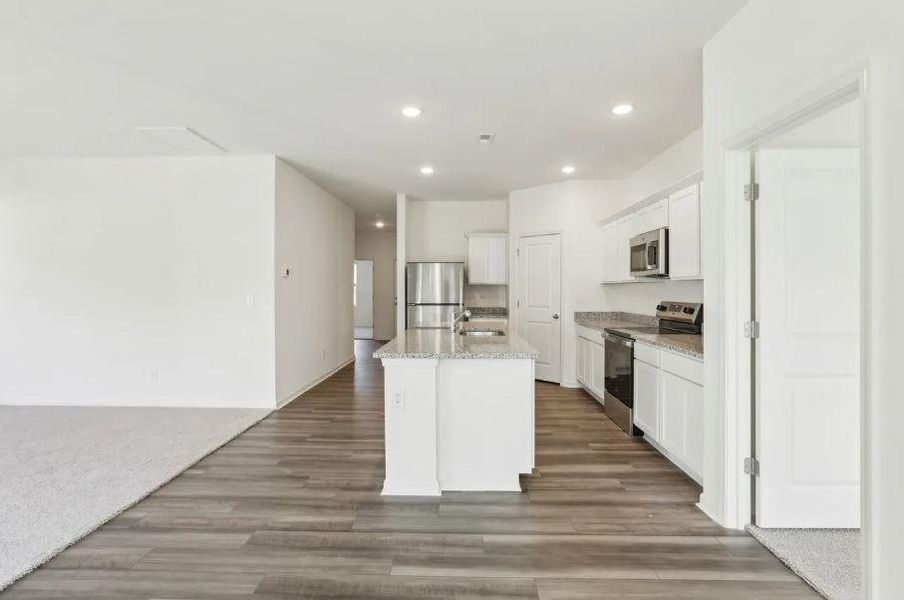 Open Concept Floorplan - From Dining to Kitchen & Family RoomLuna Elevation - Representative Photo