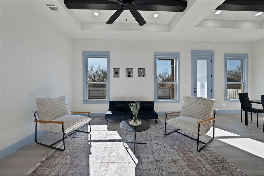 Living room featuring wood finished floors, recessed lighting, and ceiling fan