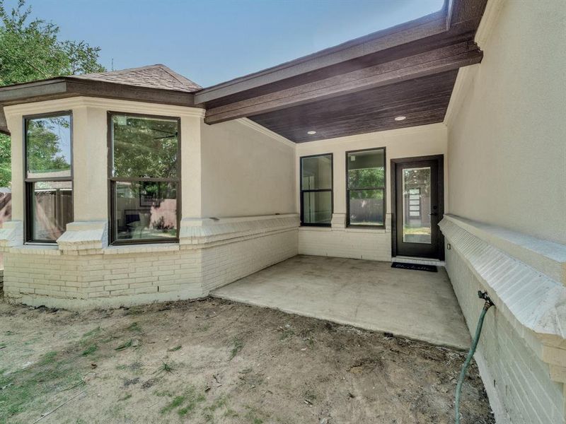 Entrance to property featuring a patio