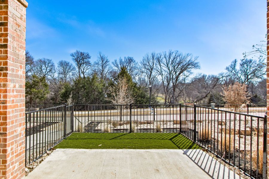 Exterior details and patio area of a home in Cottonwood Creek, Rowlett (Image 27).