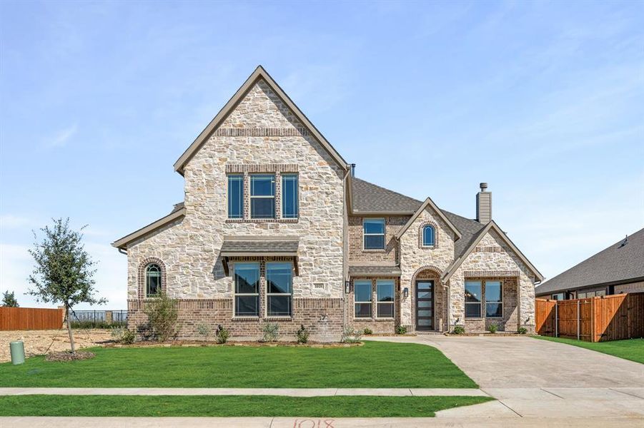 Front exterior of a new home in Timberbrook 3B-4A, Justin, TX, highlighting curb appeal (Image 2). Front exterior of a new home in Timberbrook 3B-4A, Justin, TX, highlighting curb appeal (Image 2).
