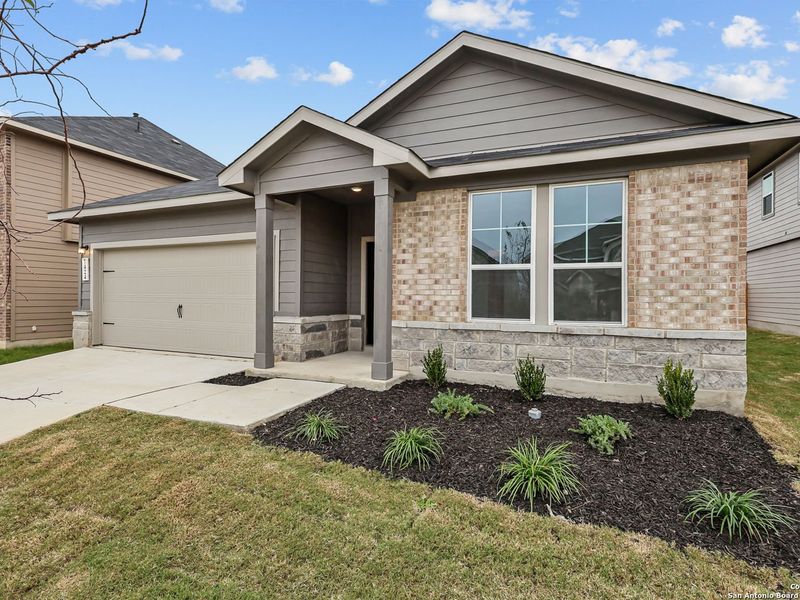 Front exterior of a new home in Horizon Pointe, San Antonio, TX, highlighting curb appeal (Image 2). Front exterior of a new home in Horizon Pointe, San Antonio, TX, highlighting curb appeal (Image 2).