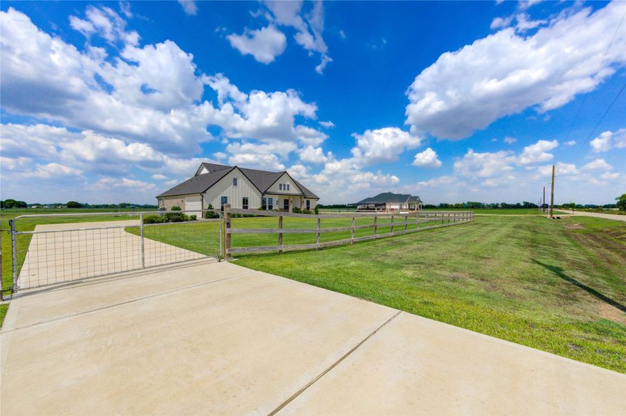 Expansive country setting with fenced acreage and wide-open views