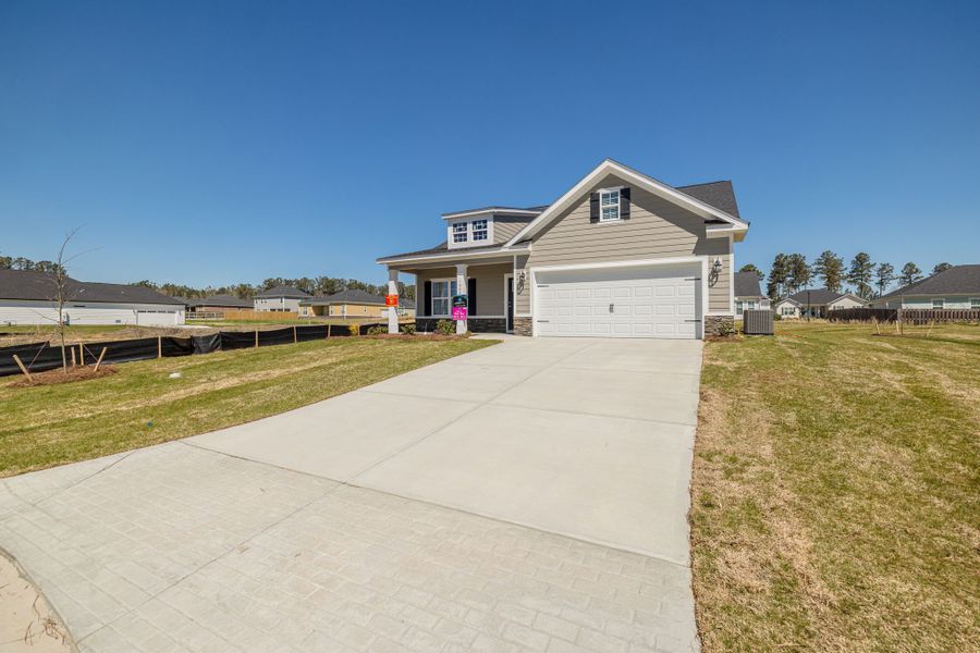 Front exterior of a new home in Millbrook, Thomson, GA, highlighting curb appeal (Image 19).