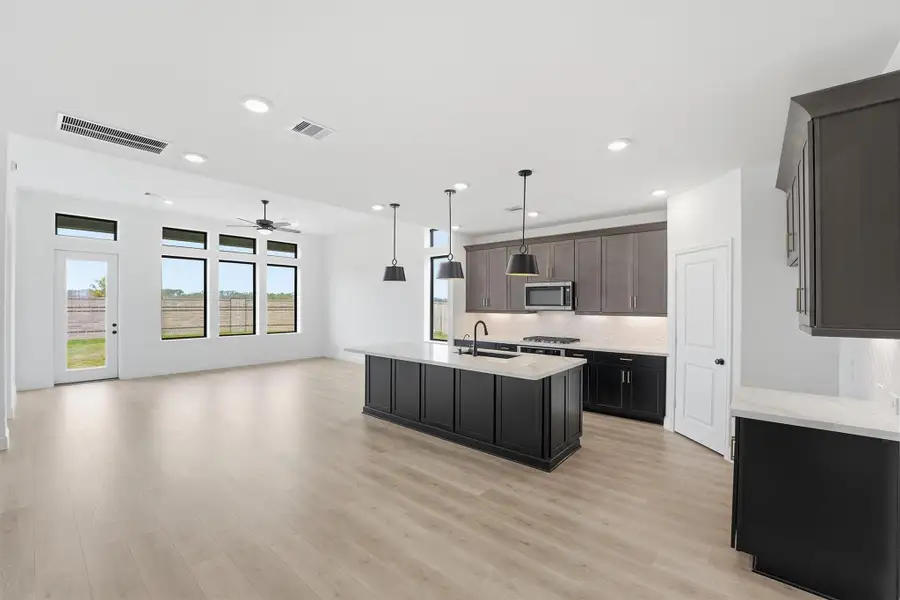 Furnished interior view inside a new home in Bridgeland, Cypress (Image 3).