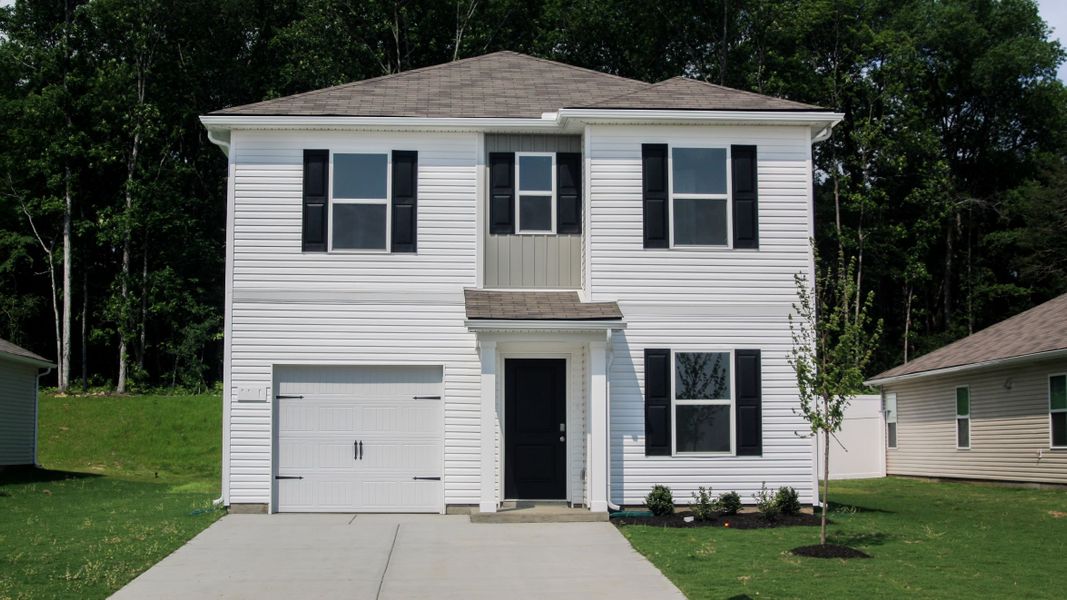Front exterior of a new home in Parkside Point, Portland, TN, highlighting curb appeal (Image 1).
