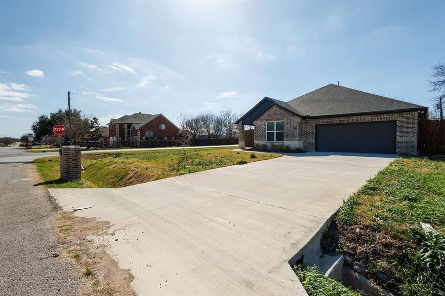 Front exterior of a new home in , Grand Prairie, TX, highlighting curb appeal (Image 1). Front exterior of a new home in , Grand Prairie, TX, highlighting curb appeal (Image 1).