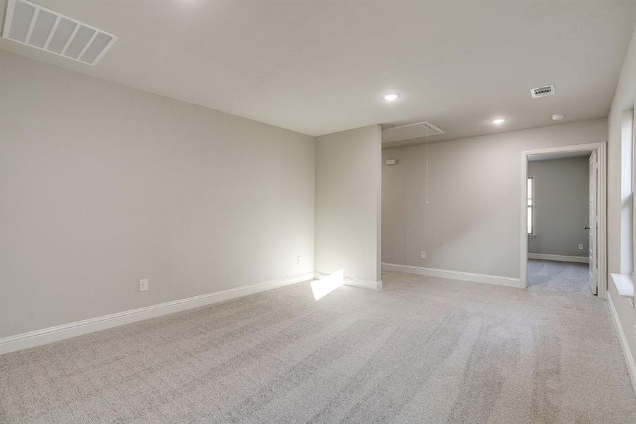 Unfurnished room featuring light carpet and recessed lighting Unfurnished room featuring light carpet and recessed lighting