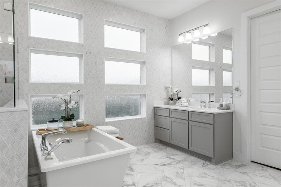 A masterpiece of design, the decorative tile accent wall in the Primary Bathroom adds a touch of opulence.