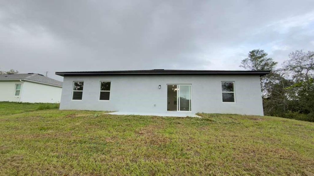 Exterior details and patio area of a home in , Ocala (Image 4).