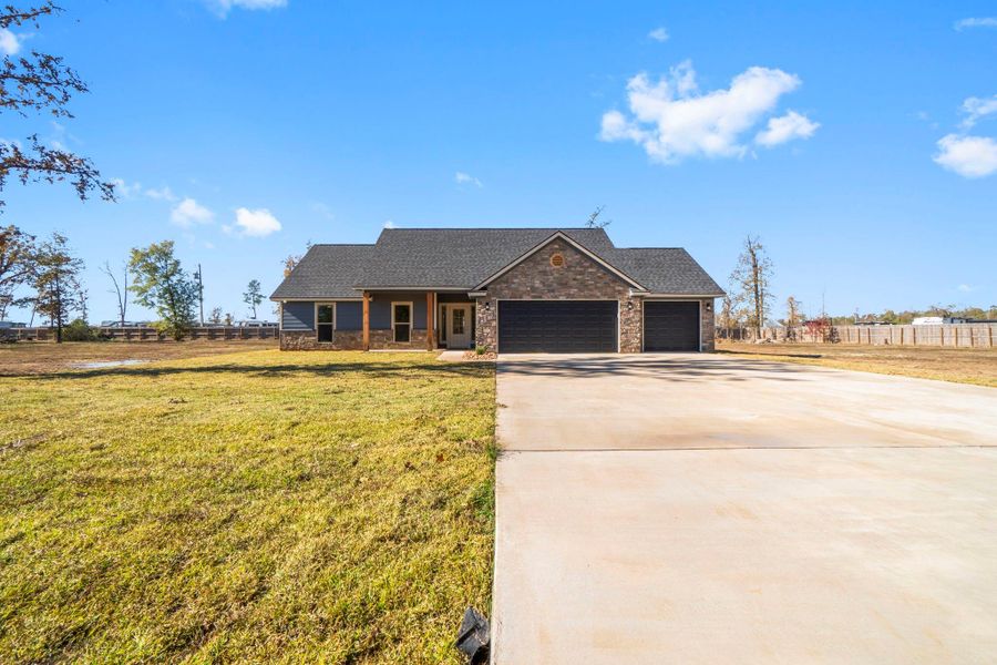 Front exterior of a new home in , Onalaska, TX, highlighting curb appeal (Image 18).