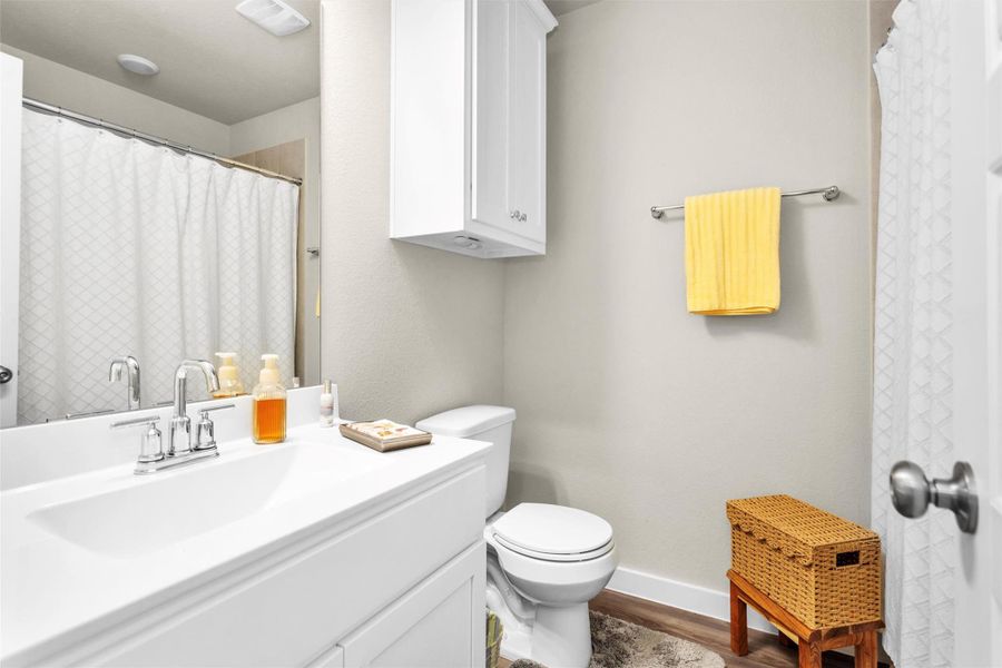 Secondary Bath is located just off the front entry and features, added by Seller, cabinet above toilet for extra storage space and a tub/shower combo. Secondary Bath is located just off the front entry and features, added by Seller, cabinet above toilet for extra storage space and a tub/shower combo.