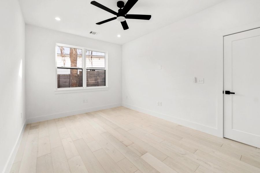Empty room with recessed lighting, light wood-type flooring, and a ceiling fan