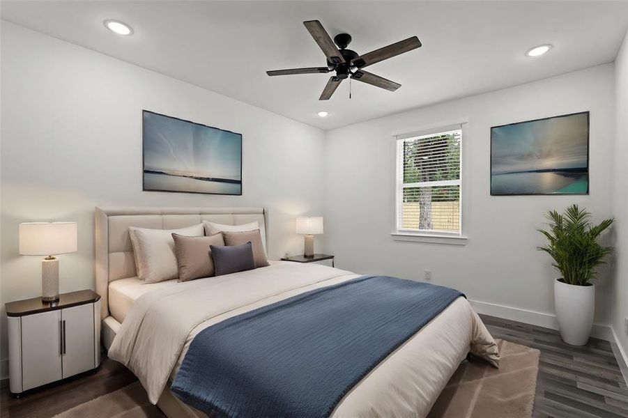 Virtully Staged: Secondary Bedroom with new vinyl floors, recessed lighting, and a ceiling fan. It is complete with a built-in closet, and has a view into your backyard.