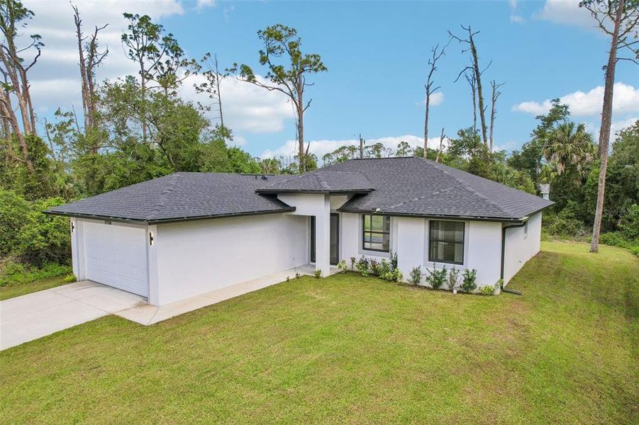 Front exterior of a new home in , Port Charlotte, FL, highlighting curb appeal (Image 25).