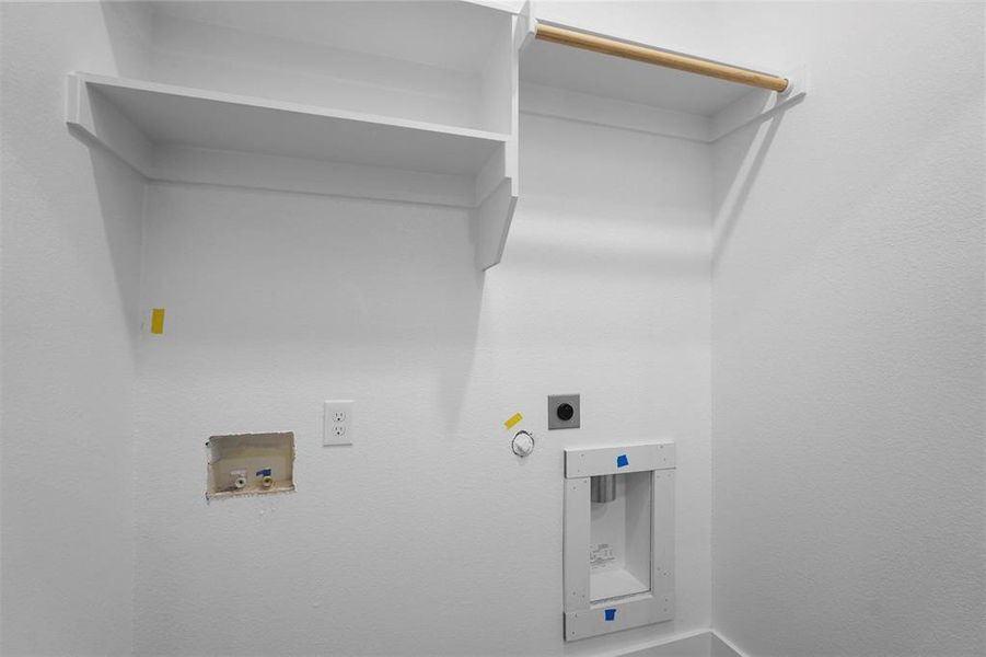 Clothes washing area with laundry area, hookup for a washing machine, hookup for an electric dryer, and hookup for a gas dryer