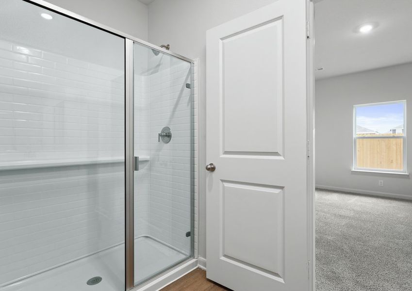 The master bathroom has a glass walk-in shower. The master bathroom has a glass walk-in shower.