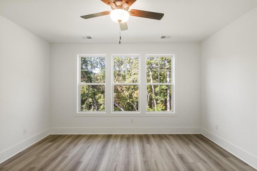 Crisp white walls frame views of nature through a
