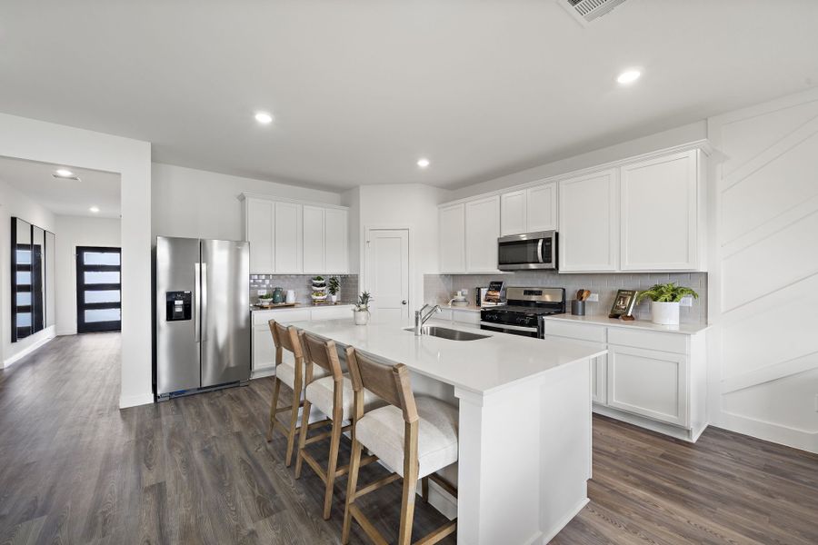 A kitchen with white cabinets. A kitchen with white cabinets.