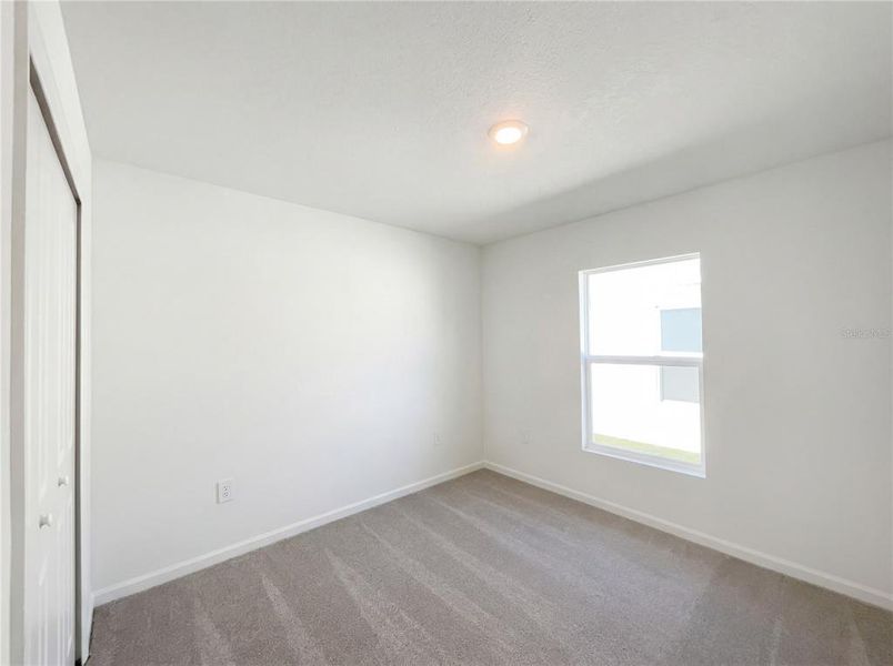 Spacious, unfurnished interior of a new home in Peace Creek Reserve, Winter Haven (Image 17).