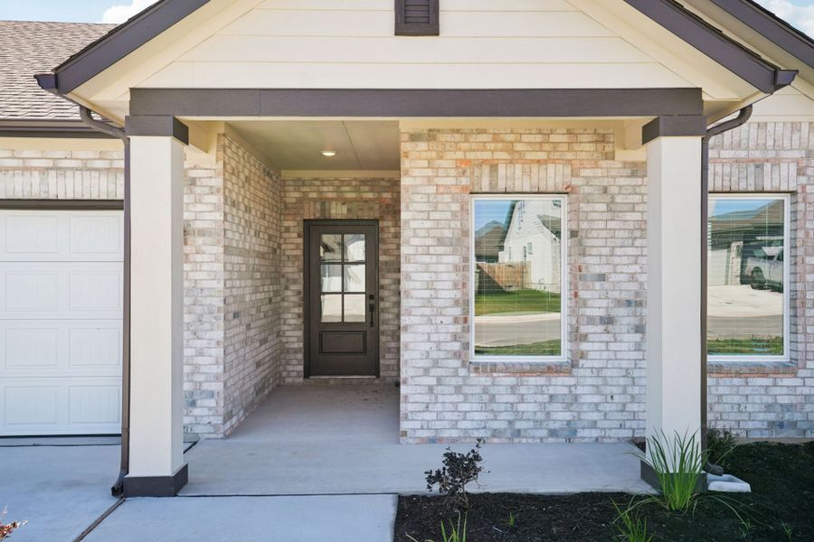 Exterior details and patio area of a home in Village at Three Oaks, Seguin (Image 20).
