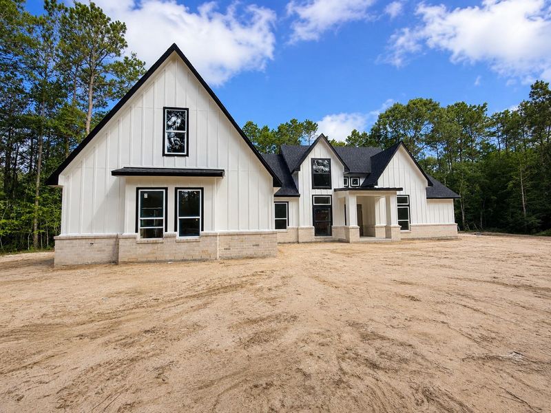 Front exterior of a new home in , Waller, TX, highlighting curb appeal (Image 2). Front exterior of a new home in , Waller, TX, highlighting curb appeal (Image 2).