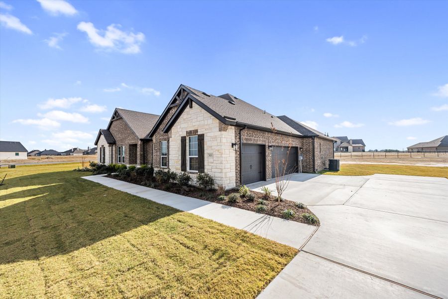 Front exterior of a new home in Eagle Ridge Estates, Weatherford, TX, highlighting curb appeal (Image 24).