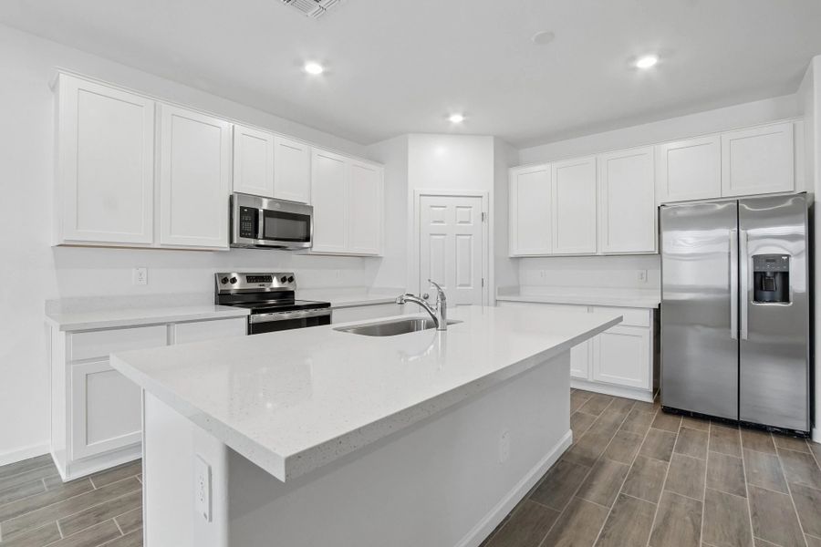 Kitchen featuring the Essentials finishes. Representative images and renderings are for illustrative purposes. Actual structural options and design finishes of home may vary. Kitchen featuring the Essentials finishes. Representative images and renderings are for illustrative purposes. Actual structural options and design finishes of home may vary.
